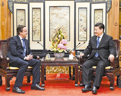 习近平会见英国前首相卡梅伦